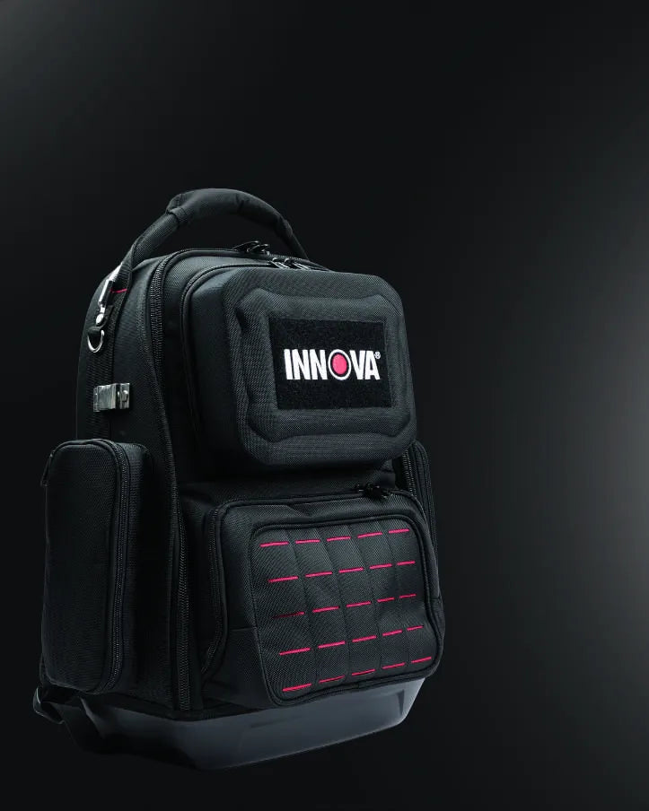 INNOVA 3996 Automotive Gear Bag, front three-quarter view, showing the hard-shell scanner compartment with embroidered INNOVA patch and the red-stitched magnetic workspace panel.
