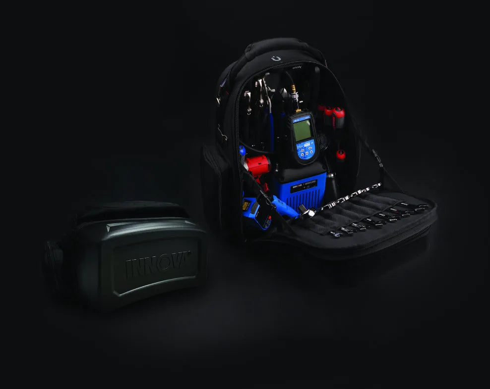 The 3996 open and fully loaded beside a hard INNOVA scanner case, showing the tool wall, socket rail and diagnostic gear.
