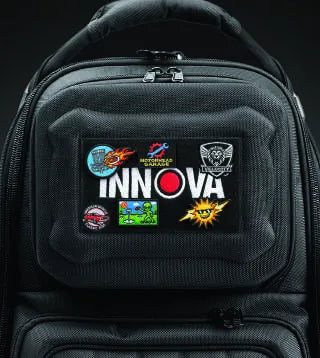 The front Velcro panel of the 3996 covered in morale patches around the INNOVA name tag.