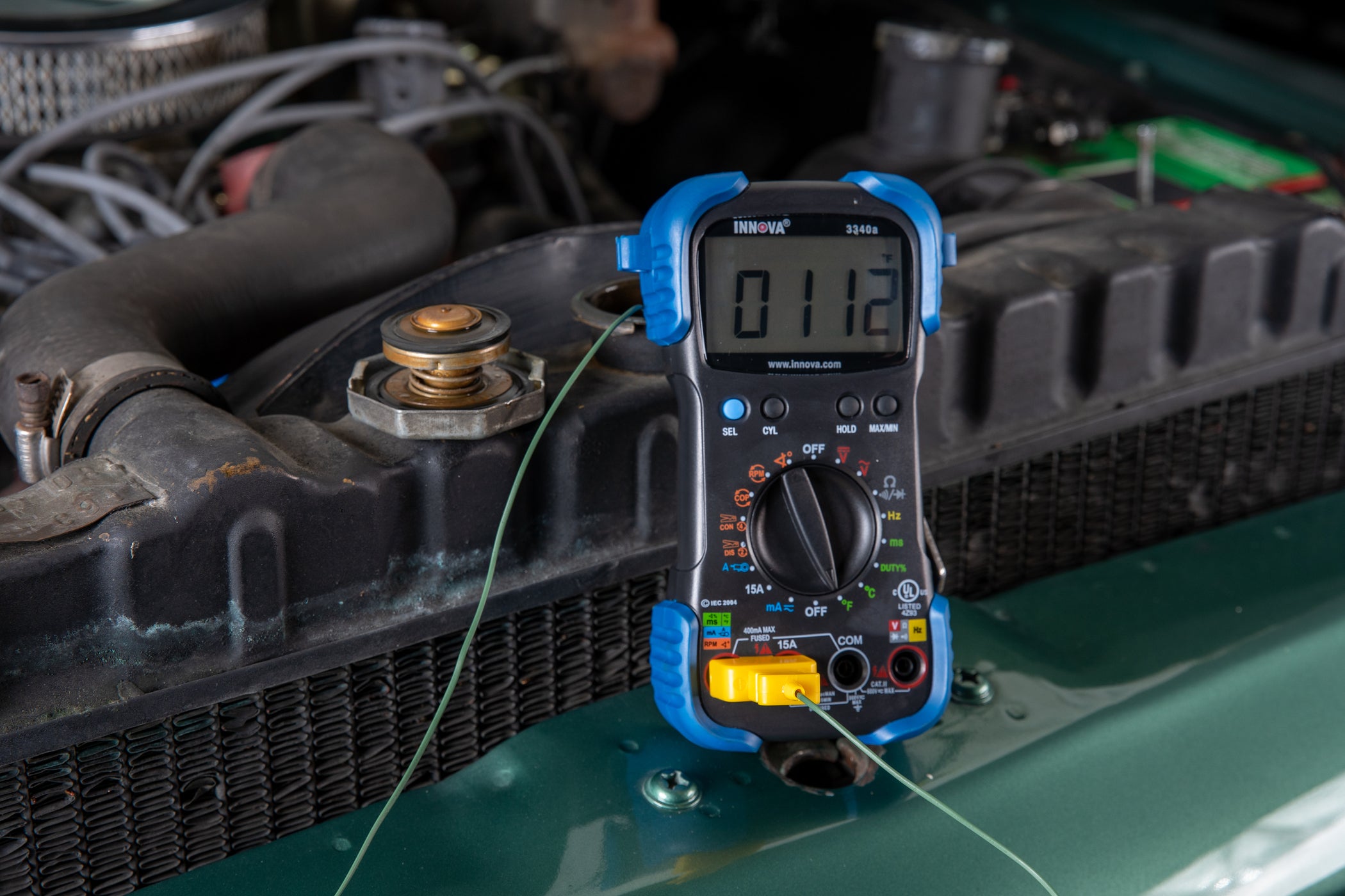 Innova Electronics 3340 digital multimeter checking radiator temperature