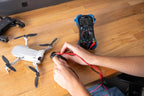 Innova Electronics 3340 digital multimeter checking voltage on a RC Drone battery